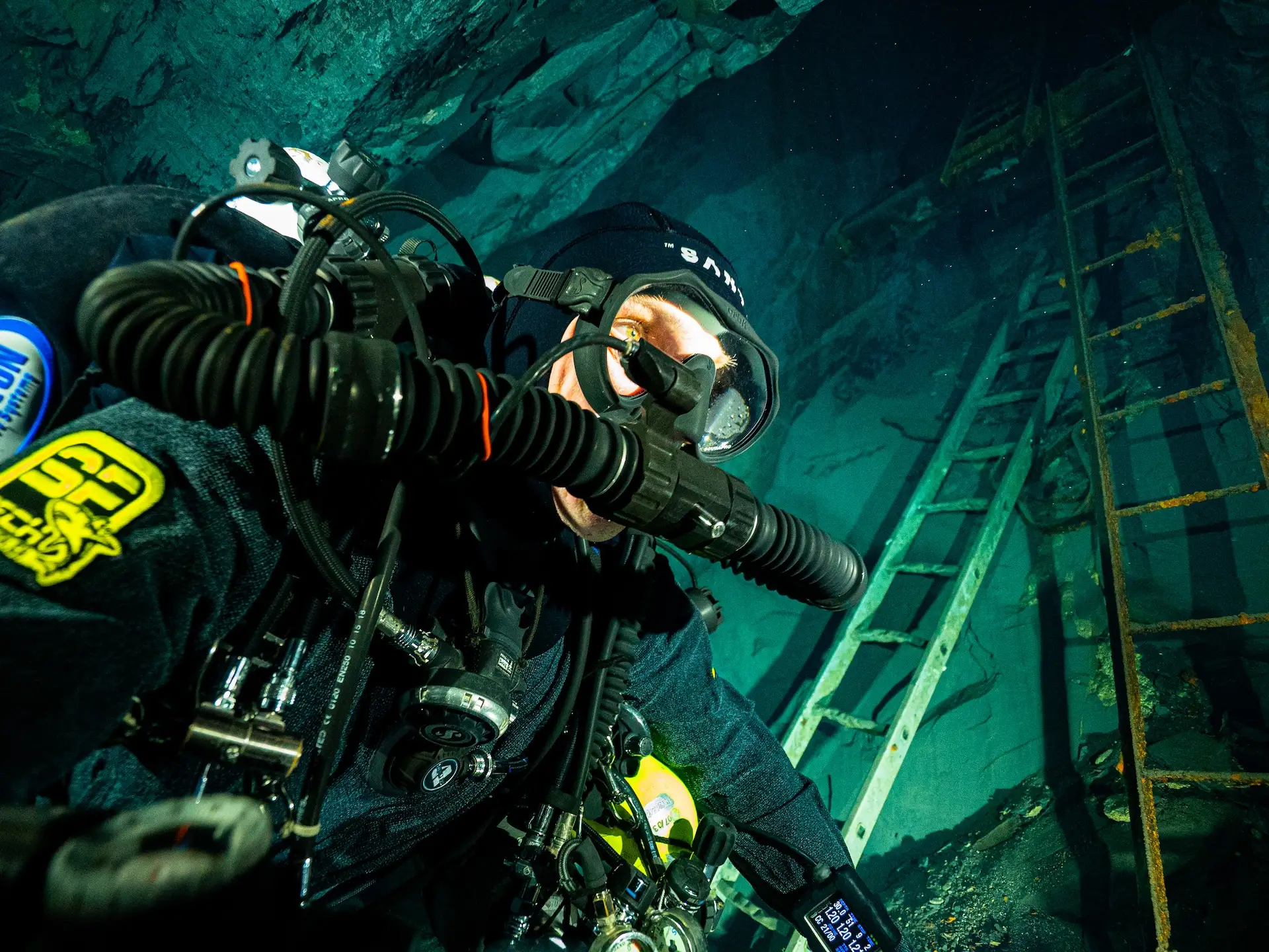 Ladder along the wall of a flooded mine shaft